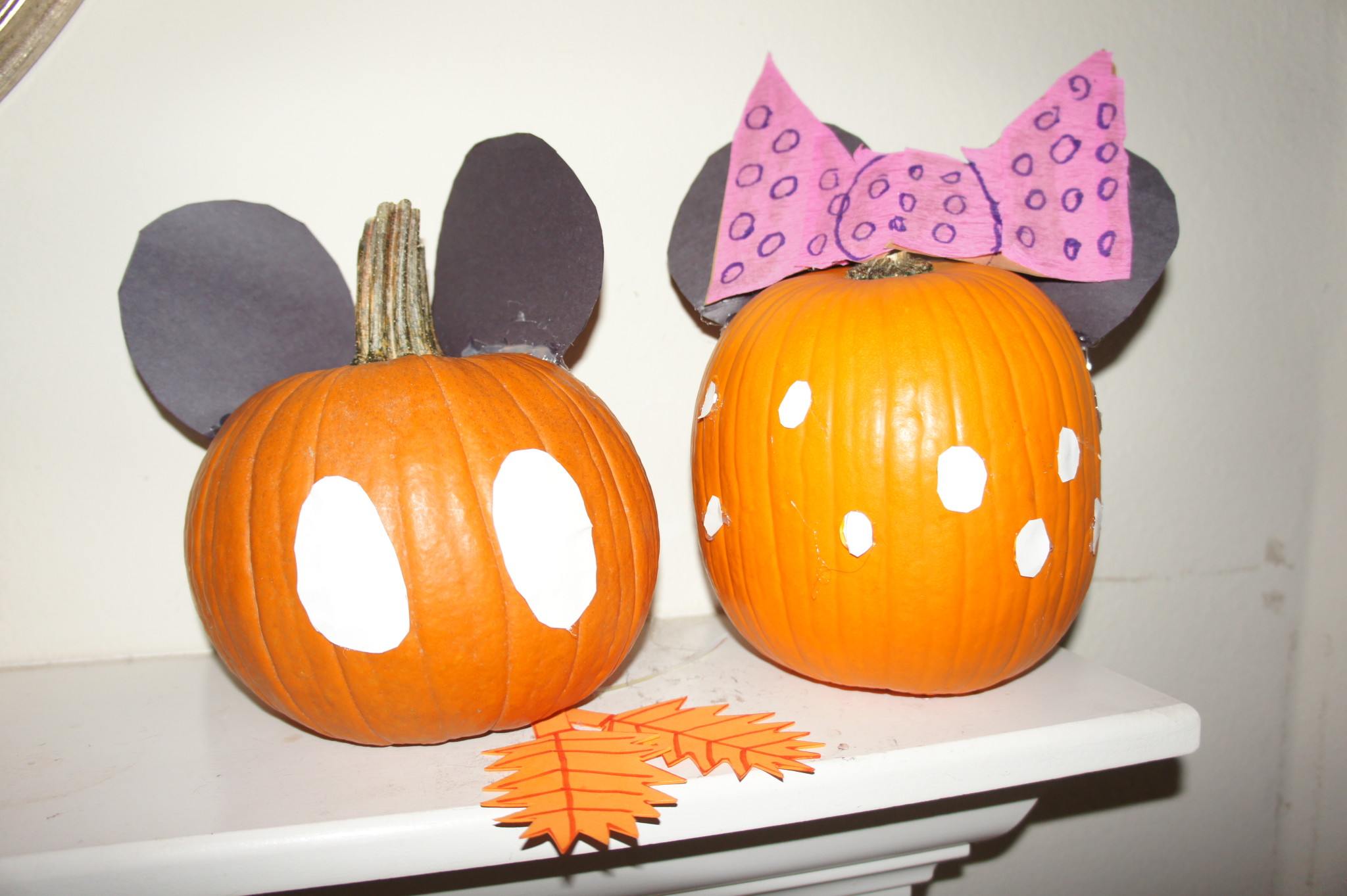 Mickey Mouse and Minnie Mouse pumpkin decorating