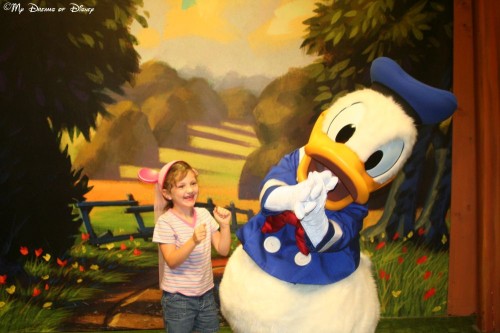 Sophie, age 6 in this photo, so excited to see Donald Duck!