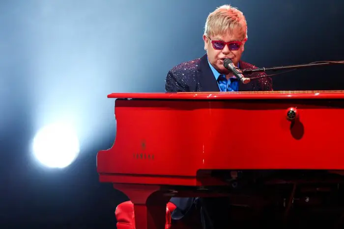 FILE - In this Wednesday, Jan. 13, 2016 file photo, Elton John performs at The Wiltern in Los Angeles. John didn't just premiere tracks from his new album at his most recent concert, he offered a tribute to his late friend David Bowie. About halfway through John's performance Wednesday night, he shared a story about Bowie, who died earlier this week. (Photo by Rich Fury/Invision/AP, File)